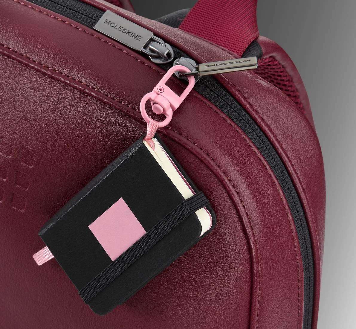 Close-up of Moleskine x BLACKPINK notebook charm in use